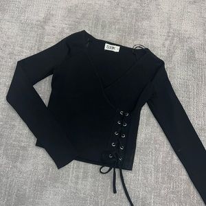 Black crop top with lace detail. Never worn.